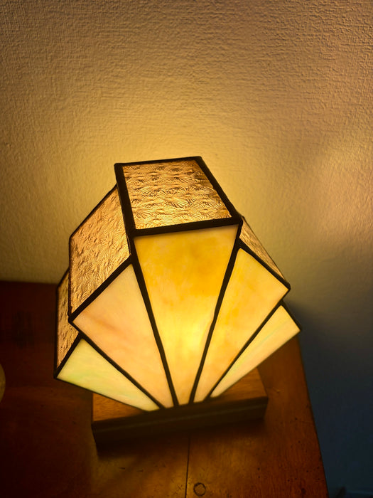 Art Deco inspired box fan table lamp on a mahogany stand in pale pearlescent pinks, greens and cream